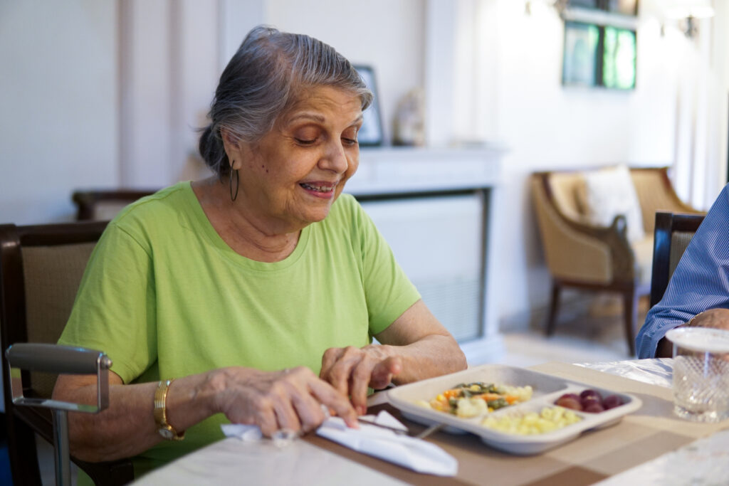 Older adult enjoying a nutritious meal at home, highlighting how Meals on Wheels supports healthy eating, independence, and aging in place in Weld County